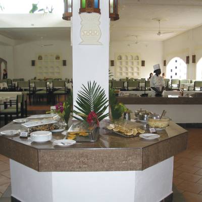 a modern kitchen with an island in the middle of a table