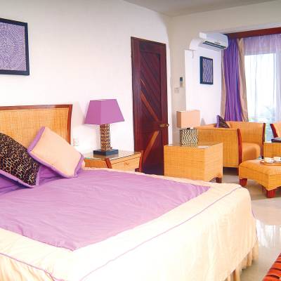 a bedroom with a large bed in a room