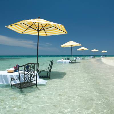an umbrella sitting on top of a beach