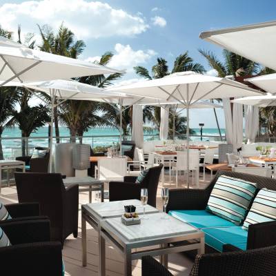 a table topped with a blue umbrella
