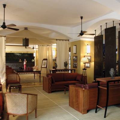 a living room filled with furniture and a fireplace