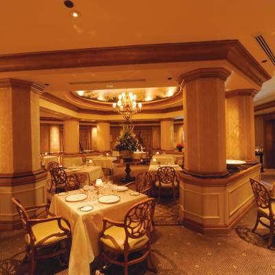 a room filled with furniture and vase on a table