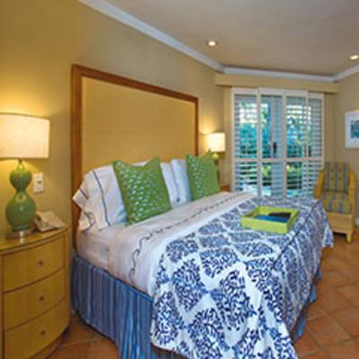 a bedroom with a bed in a room