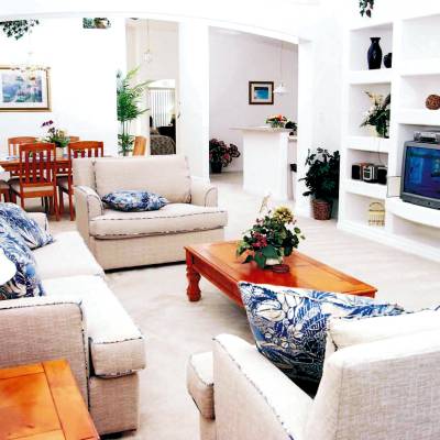 a living room filled with furniture and a fireplace