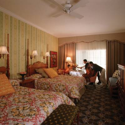 a bedroom with a bed in a room