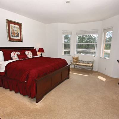 a living room filled with furniture and a flat screen tv