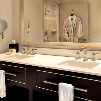 a double sink and large mirror
