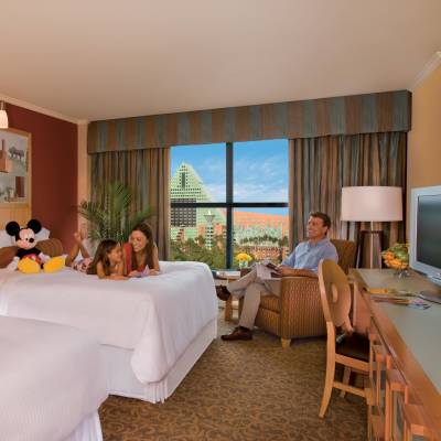 a bedroom with a large bed in a hotel room