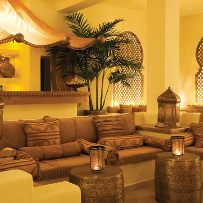 a living room filled with furniture and a fire place