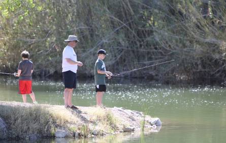 a couple of people that are standing in the water