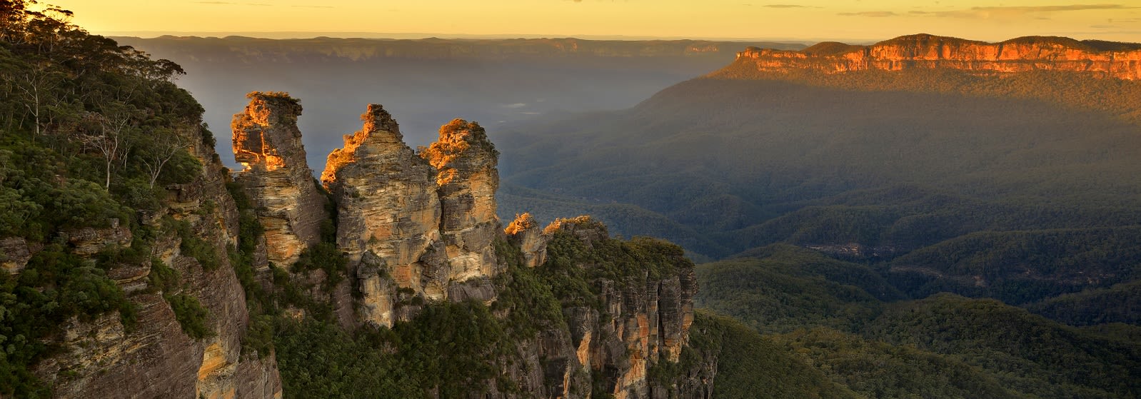 Enchanting Travels Australia ToursSunrise in Blue Mountains. View on Three Sisters Rock Formation Australia Vacation - The Grampians