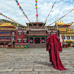 Enchanting Travels Tibet Tours lama going towards the temple Tibet