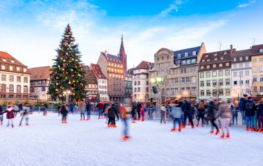 Enchanting Travels France Tours Ice Skating near the Cathedral in Strasbourg