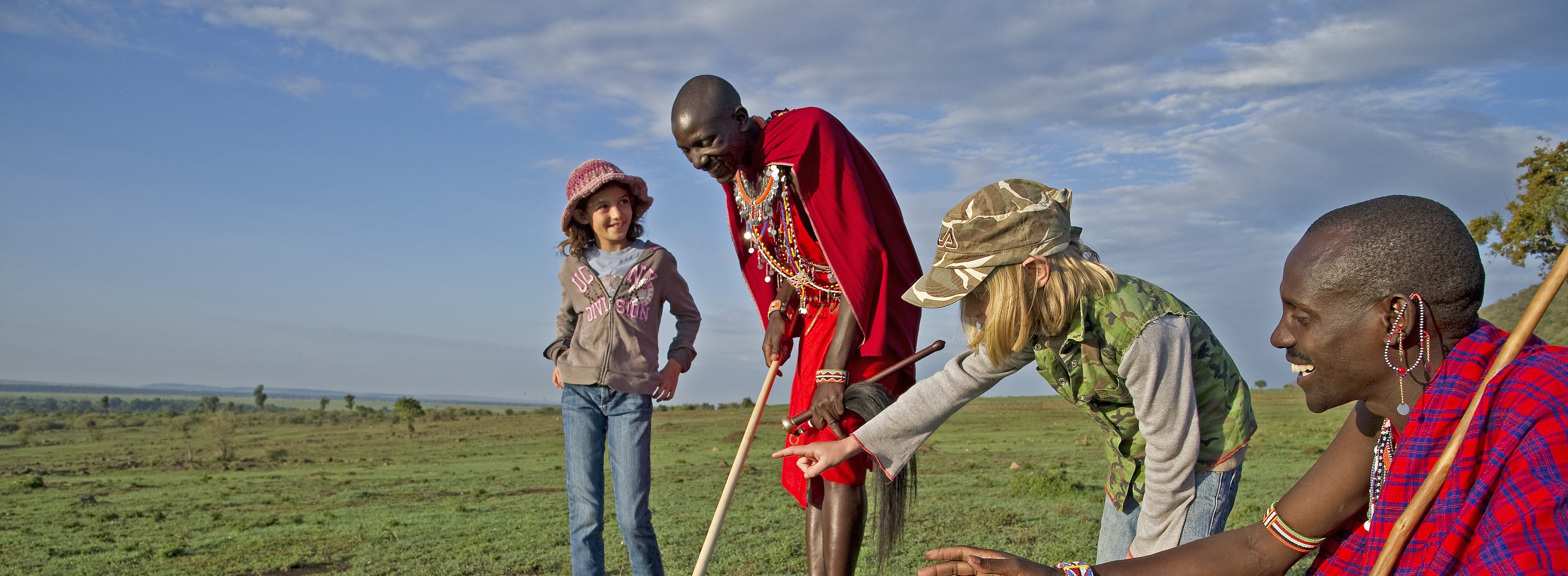 Enchanting Travels Kenya Tours Masai Mara Hotels Sanctuary Olanana Camp walk with guests Loyalty and Referral Programs