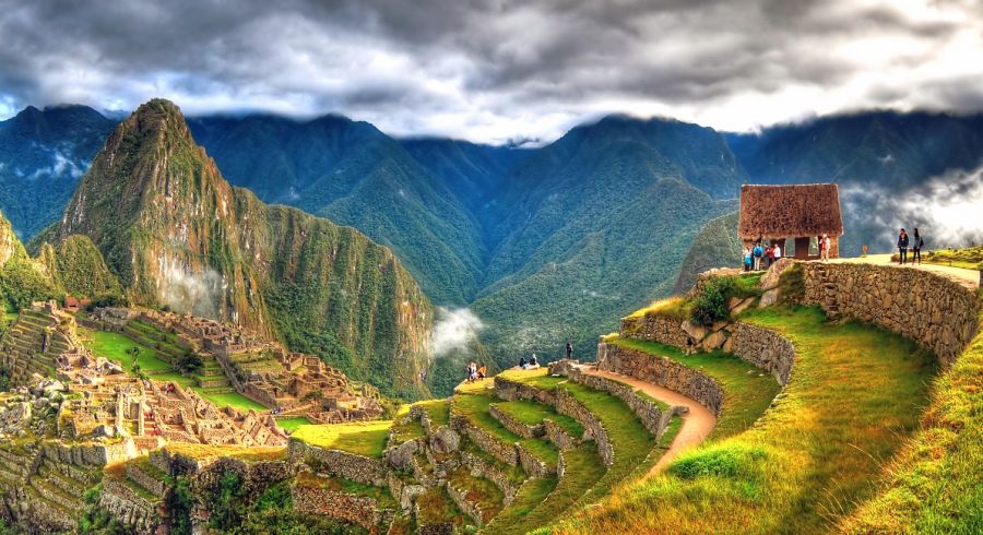 Enchanting Travels Peru Tours - Panoramic HDR image of Machu Picchu, the lost city of the Incas on a cloudy day. Machu Picchu is one of the new 7 Wonder of the Word near Cusco
