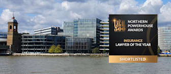 A large office building with a modern glass facade sits behind a river under a partly cloudy sky. An award graphic in the foreground reads: "The Legal 500 Northern Powerhouse Awards - Insurance Lawyer of the Year - Shortlisted.