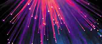 An abstract image featuring numerous streaks of vibrant pink, purple, and blue light radiating downward against a dark background. The lights create a dynamic, almost fiber-optic effect, with glowing orbs resembling bokeh effects scattered at the bottom.