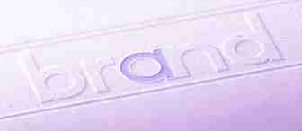 A close-up image shows the word "brand" embossed on a textured surface. The "a" in the word is highlighted in a light purple color. The entire image has a purple tint.