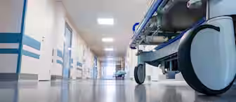 A hospital bed in a hallway.