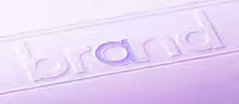 A close-up image shows the word "brand" embossed on a textured surface. The "a" in the word is highlighted in a light purple color. The entire image has a purple tint.