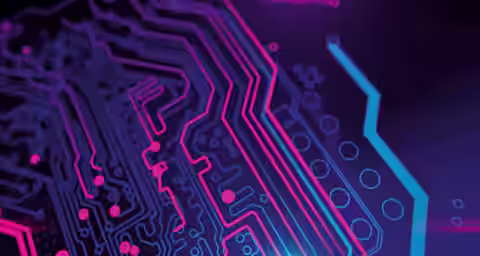 A close-up of a futuristic electronic circuit board, featuring neon pink and blue lines and dots against a dark purple background. The design highlights interconnected pathways and components, giving a high-tech, digital feel.