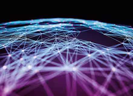 A dark background with a web of interconnected blue and purple lines forming a network. Numerous glowing white nodes are scattered throughout the web, creating a complex, geometric pattern that suggests a digital or technological theme.