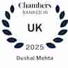 A logo featuring laurel leaves surrounding the text: "Chambers Ranked in UK 2025 Dushal Mehta.
