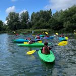 Kayak group paddling on Stanborough Lake