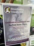 Breastfeeding Friendly Scheme certificate of commitment displayed on a noticeboard.