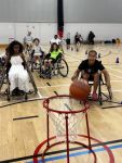 group of young people playing wheelchair basketball