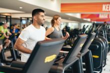 image shows people running on a treadmil image shows people running on a treadmil