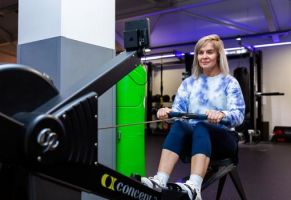 Lady on a rowing machine in the gym
