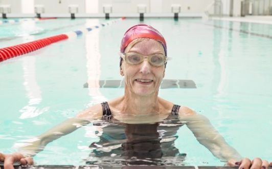 Female swimmer with swim cap on