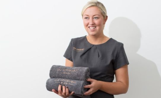 Spa Therapist holding towels 