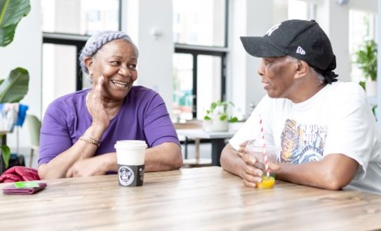 Better members talking in the cafe over a cup of coffee