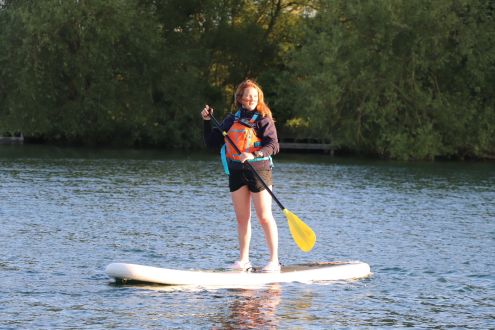 Woman paddleboarding on Stanborough Lake