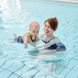 Mum and baby enjoying some pool time together