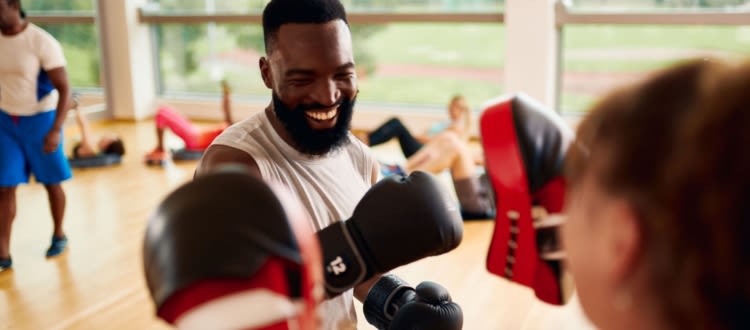 Man smiling while boxing