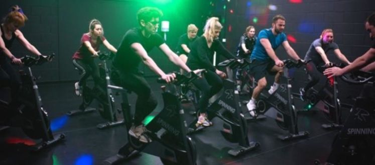 Community enjoying a group cycle class