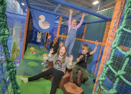 group of children in a colourful soft play