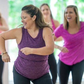 A group of women having fun in a fitness class