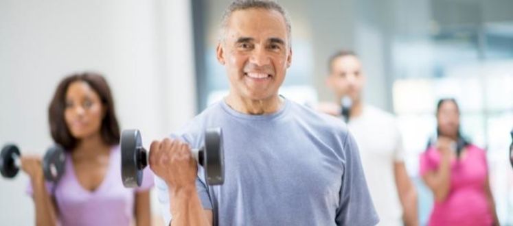 An image of a fitness class with had weights