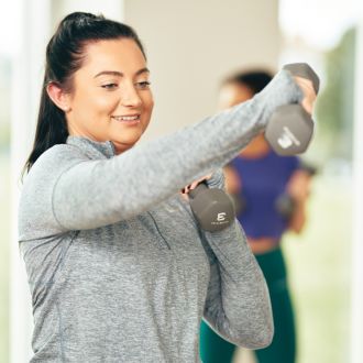 lady wearing grey with weights 