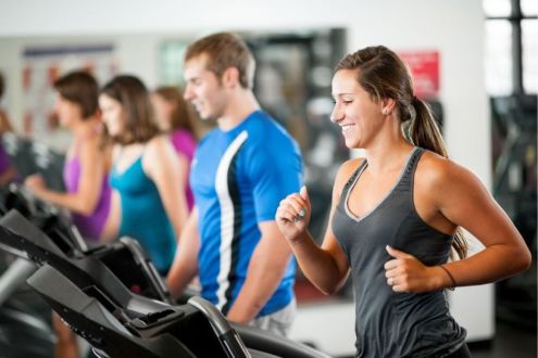 Adult group using gym equipment