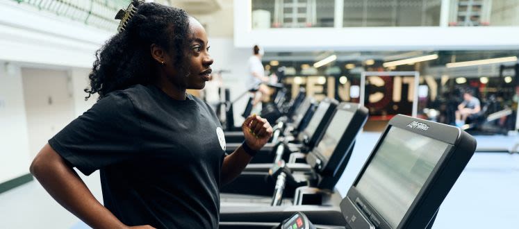 image shows a lady on a treadmill