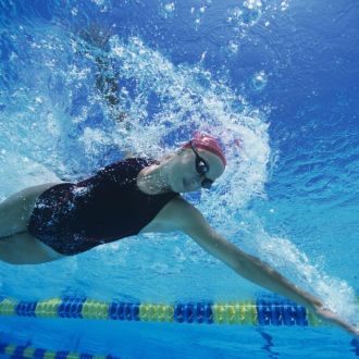 A Swimmer swimming Frontcrawl in a lane. 