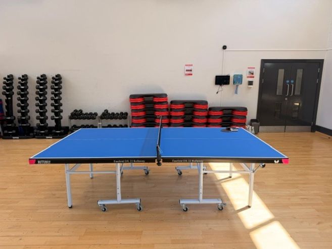 Studio space with table tennis set up for play