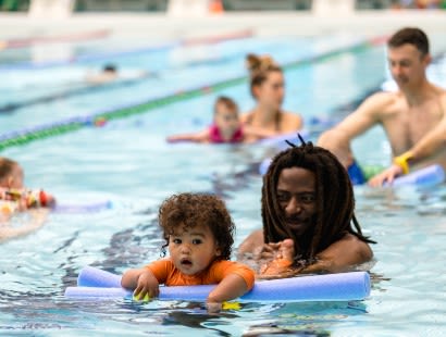 baby learning to swim