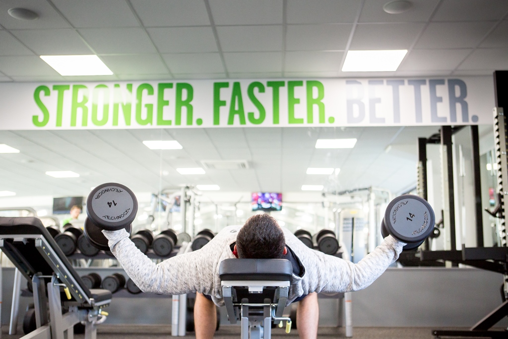 Man enjoying a gym workout at Better, Bodmin Leisure Centre Man enjoying a gym workout at Better, Bodmin Leisure Centre