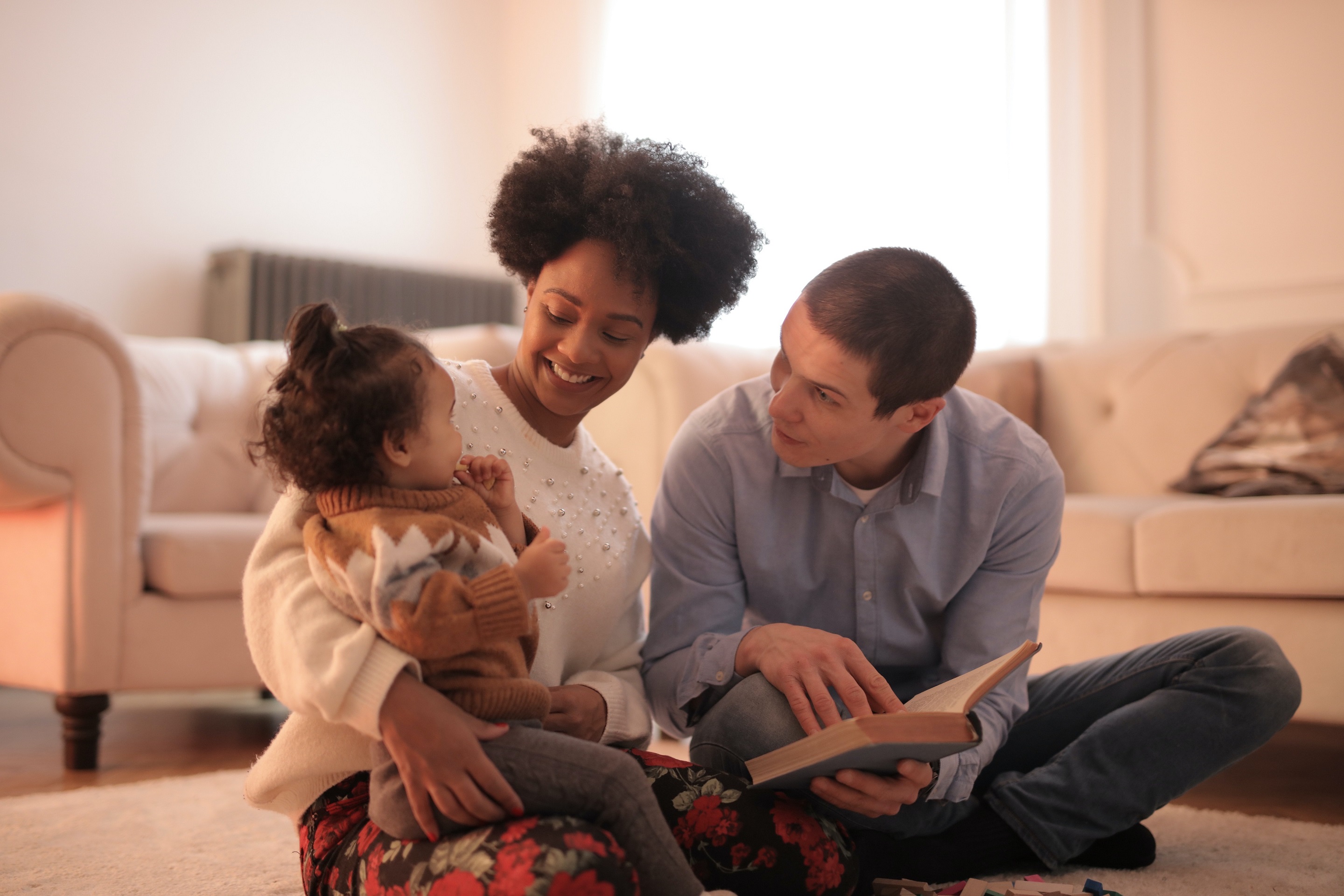Photo of man and woman having fun with their baby 3820059